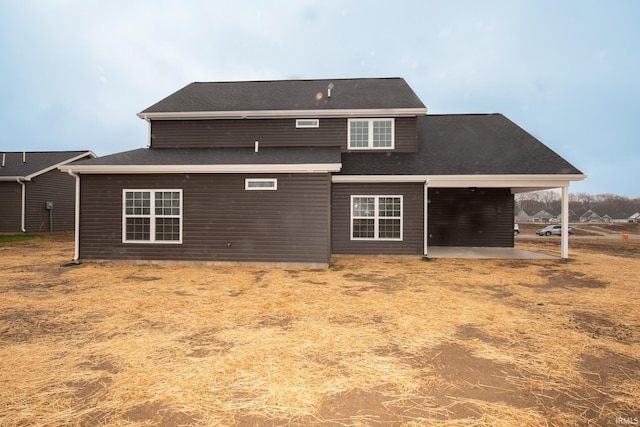 rear view of property featuring a patio