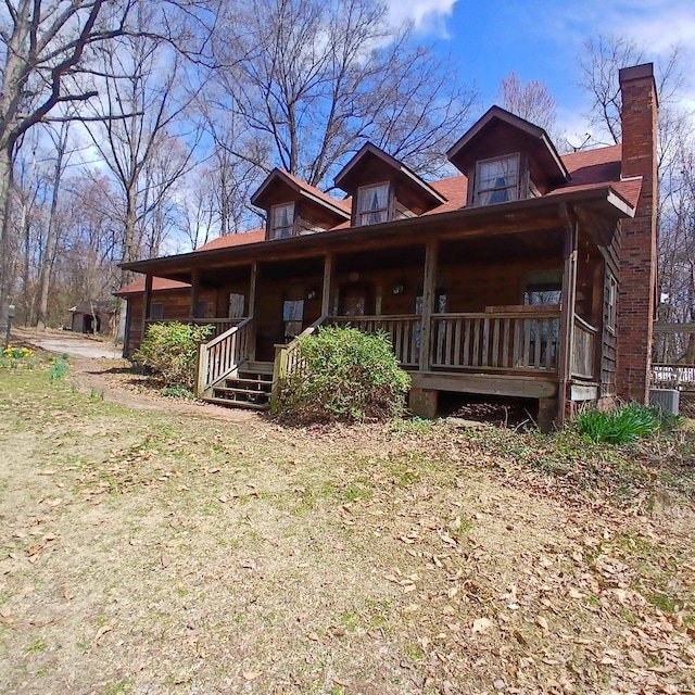 105 Jacob Orch, Odon, IN 47562 - view of front facade featuring a porch and a chimney