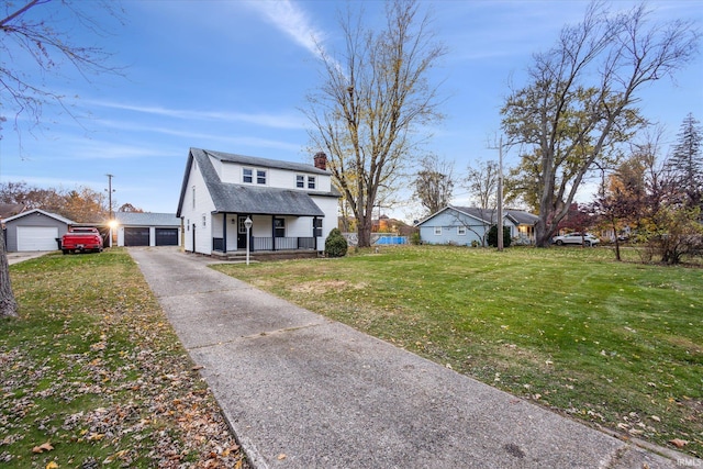 view of front of house with covered porch, a front yard, and a garage