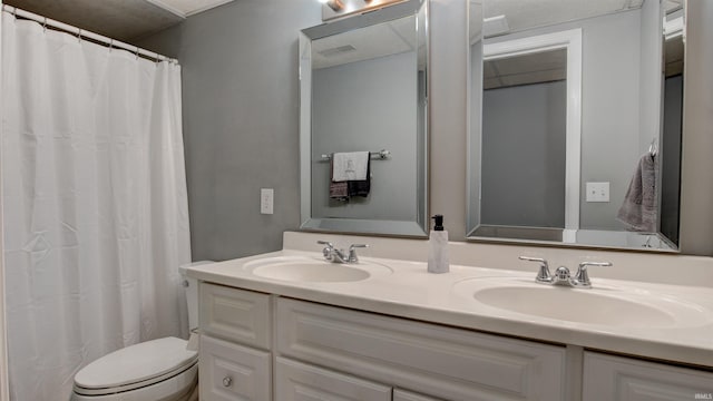 bathroom with a shower with curtain, vanity, and toilet