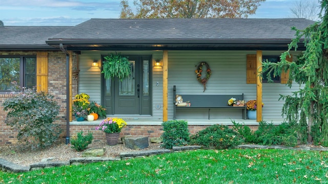 doorway to property with covered porch