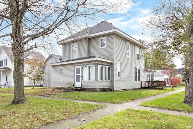 view of property exterior featuring a lawn