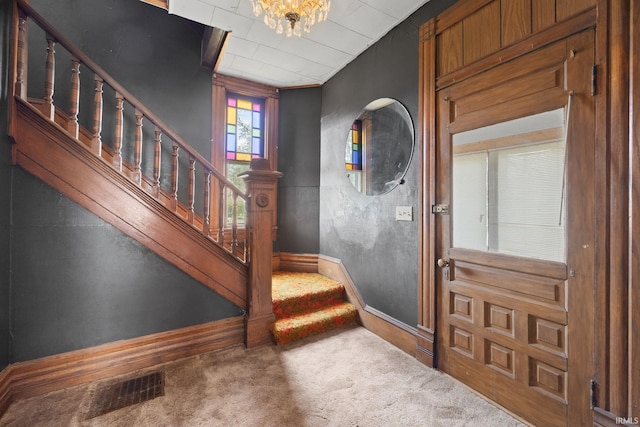 foyer featuring carpet floors