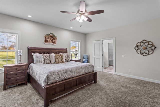 bedroom with connected bathroom, ceiling fan, and carpet