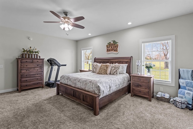 bedroom featuring ceiling fan and carpet