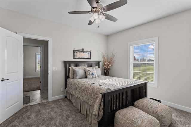 carpeted bedroom with ceiling fan