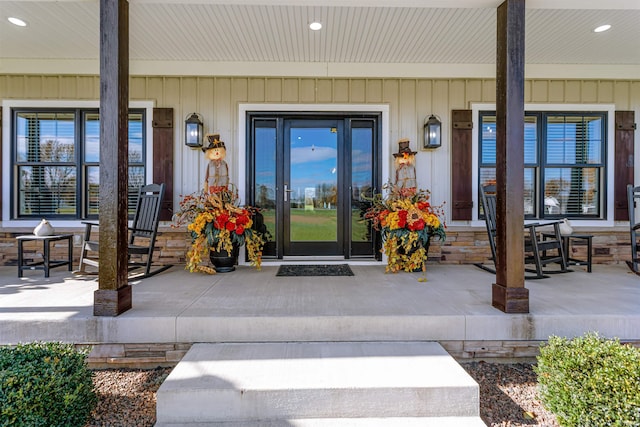 doorway to property featuring covered porch