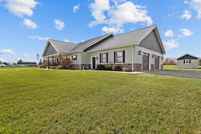 view of front of property featuring a garage and a front lawn