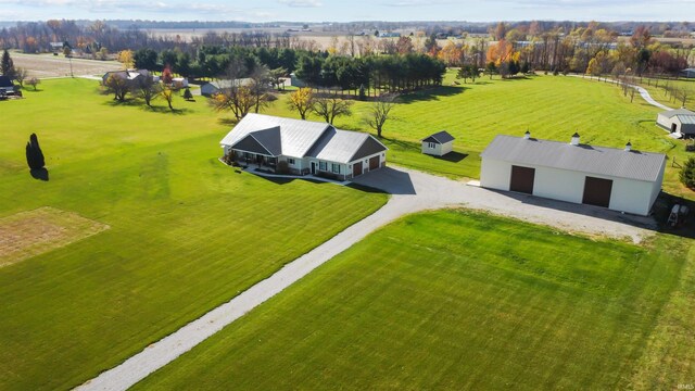 birds eye view of property featuring a rural view