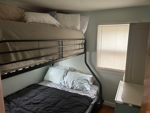 bedroom featuring dark wood-type flooring