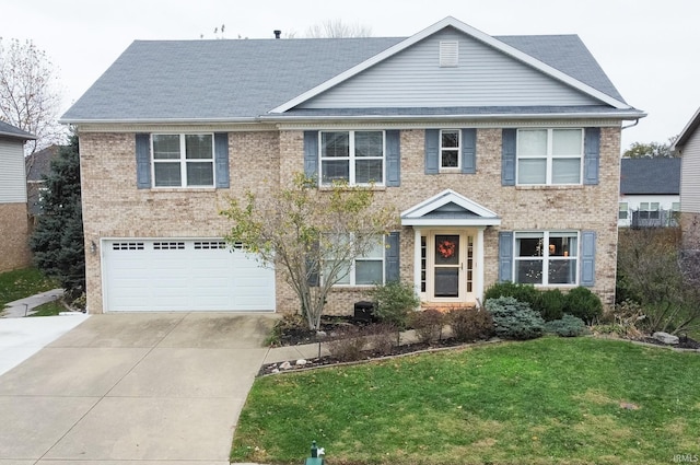 view of front of property featuring driveway, brick siding, an attached garage, and a front yard