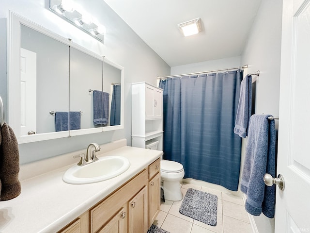 full bath with a shower with curtain, vanity, toilet, and tile patterned floors