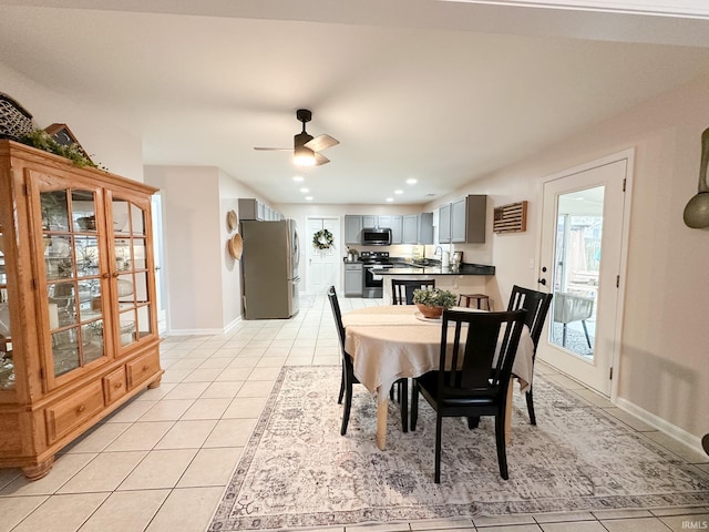 dining area featuring recessed lighting, baseboards, ceiling fan, and light tile patterned flooring