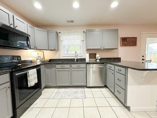 kitchen with recessed lighting, electric range, a sink, dishwasher, and a peninsula