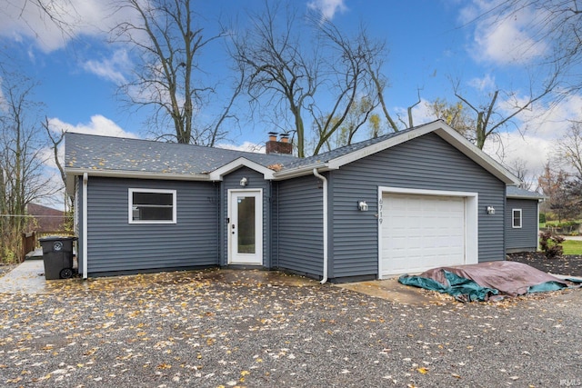 ranch-style home featuring a garage