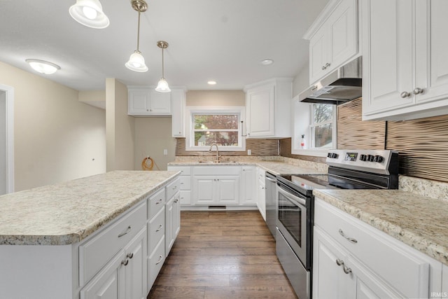 kitchen with stainless steel electric stove, white cabinetry, and sink