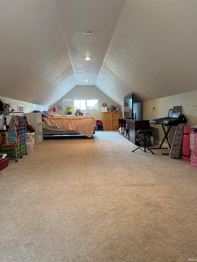 bedroom featuring light colored carpet and lofted ceiling