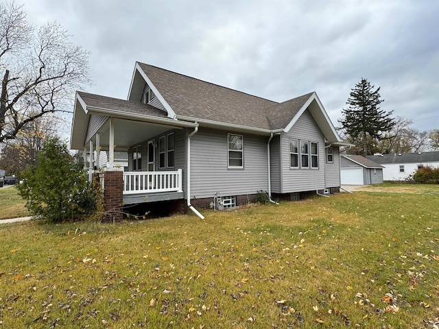 view of home's exterior featuring a lawn, a porch, and a garage