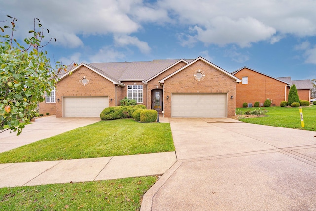 4597 Sierra Dr, Boonville, IN 47601 - traditional-style home featuring driveway, brick siding, a front yard, and an attached garage