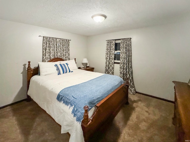 carpeted bedroom with a textured ceiling