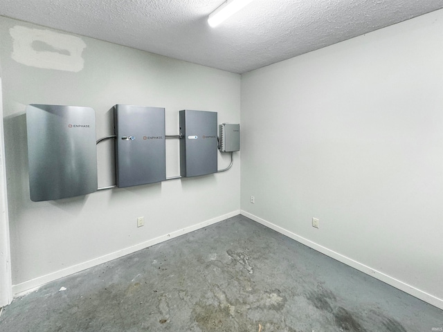 spare room with a textured ceiling