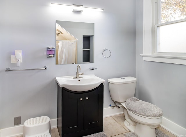 bathroom with tile patterned flooring, vanity, toilet, and a shower with shower curtain