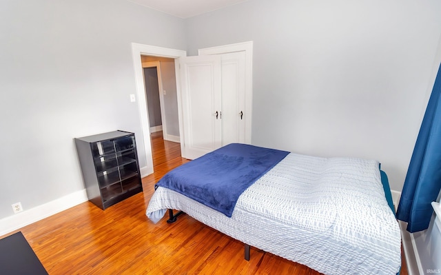 bedroom with wood-type flooring