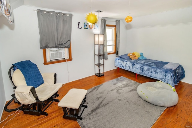 bedroom featuring cooling unit and wood-type flooring