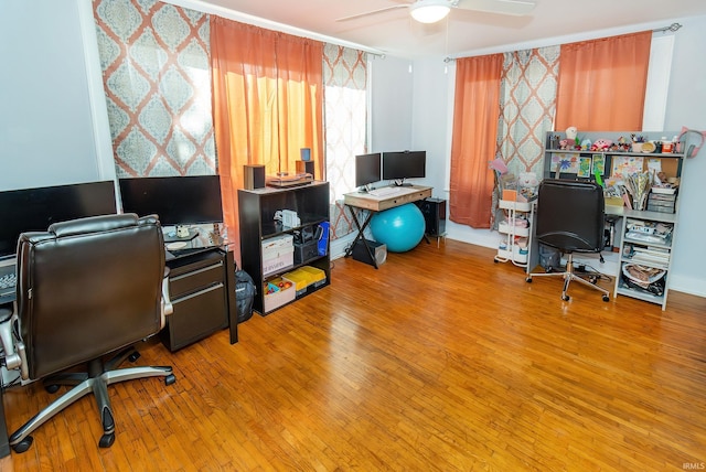 home office featuring hardwood / wood-style flooring and ceiling fan