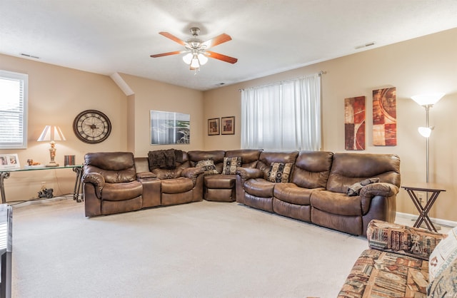 living room with carpet floors and ceiling fan