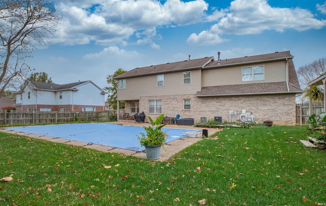 view of swimming pool with a patio and a lawn