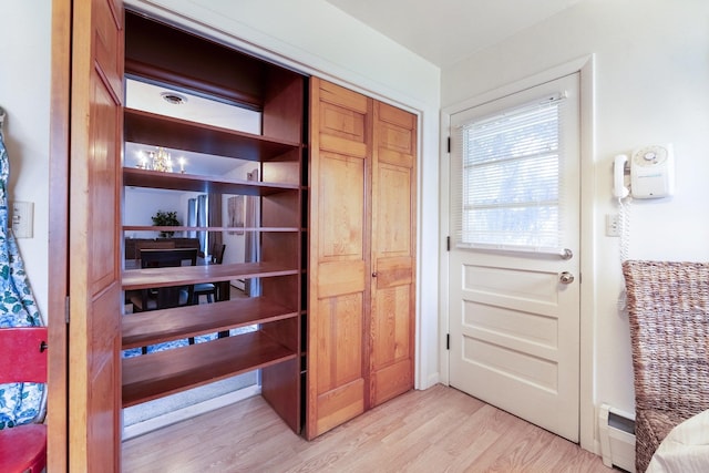 closet featuring a baseboard radiator