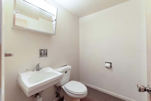 bathroom with toilet and sink