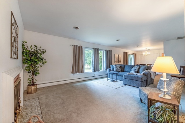 living room with baseboard heating, carpet floors, and a notable chandelier