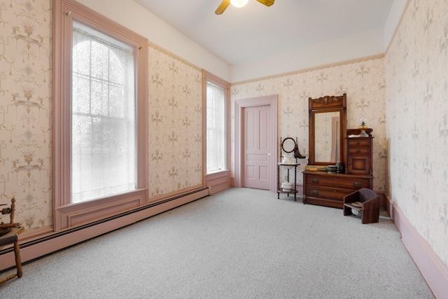 205 W Swager Dr, Fremont, IN 46737 - living area with carpet, baseboard heating, wallpapered walls, and plenty of natural light