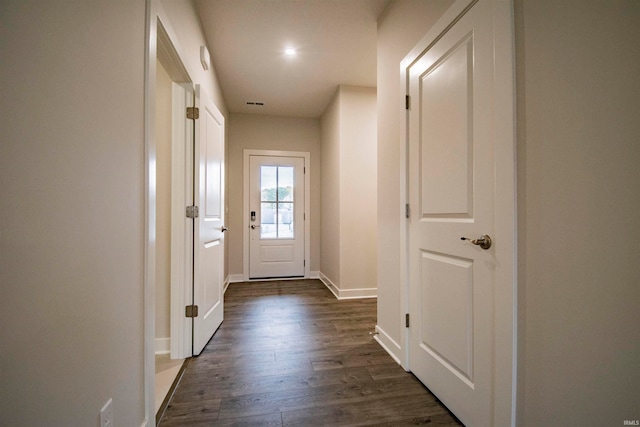 entryway with dark hardwood / wood-style flooring