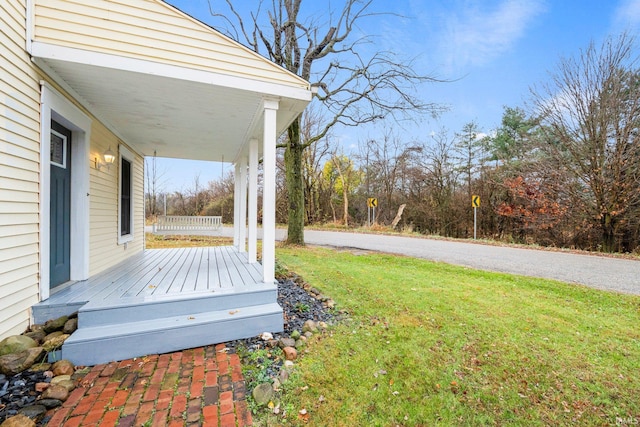 view of yard with covered porch