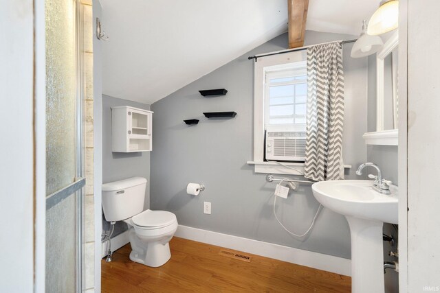 bathroom with lofted ceiling with beams, cooling unit, sink, toilet, and wood-type flooring