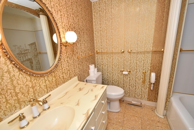 bathroom featuring a bath, vanity, and toilet