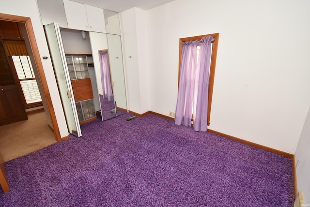 unfurnished bedroom with carpet and a closet