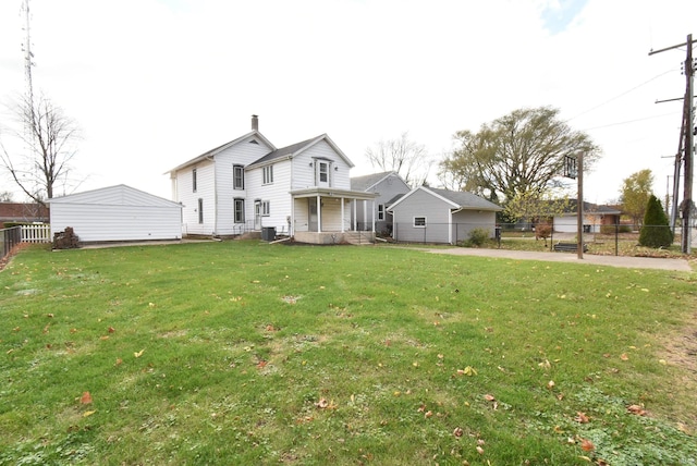 view of front of home featuring covered porch and a front yard