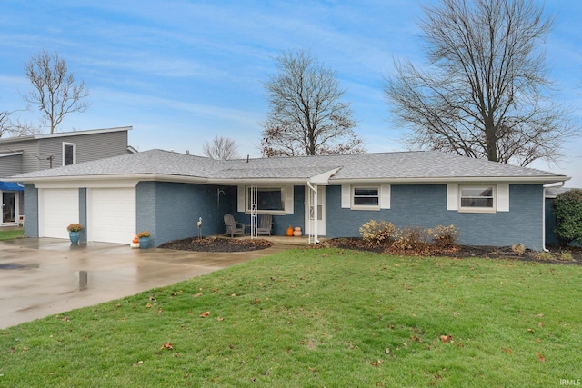 single story home with a front yard and a garage