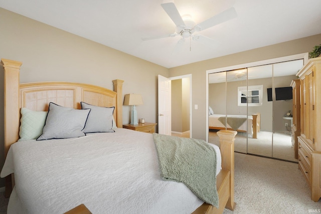 carpeted bedroom with a closet and ceiling fan