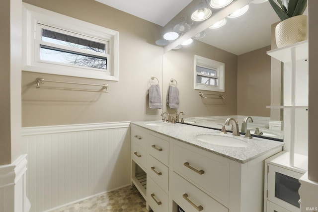 31 Ems C28G Ln, Warsaw, IN 46582 - bathroom featuring wainscoting and double vanity