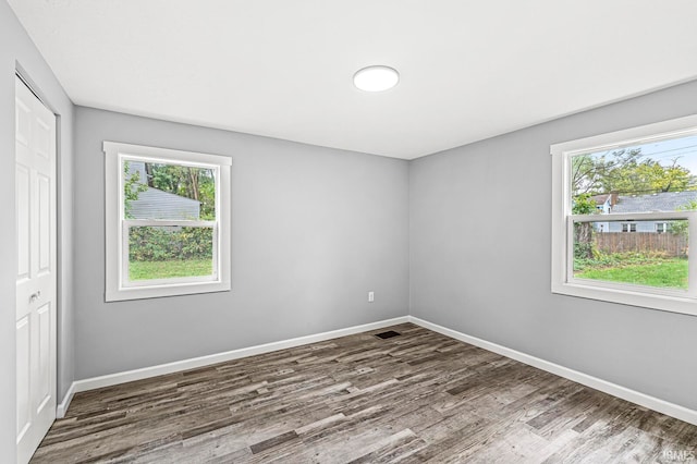 empty room featuring wood-type flooring