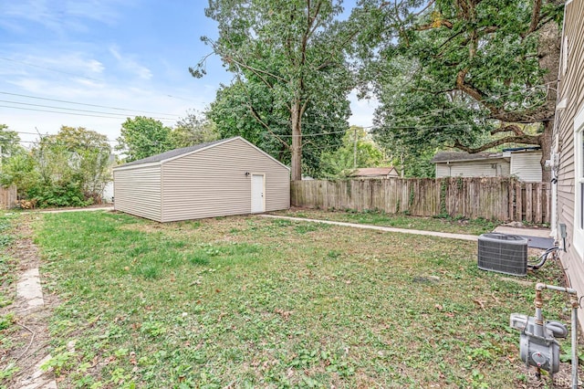 view of yard with central air condition unit and a storage shed