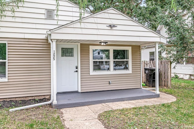 property entrance featuring covered porch