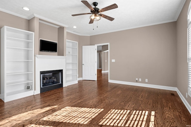 unfurnished living room with dark hardwood / wood-style floors, ceiling fan, built in features, and crown molding