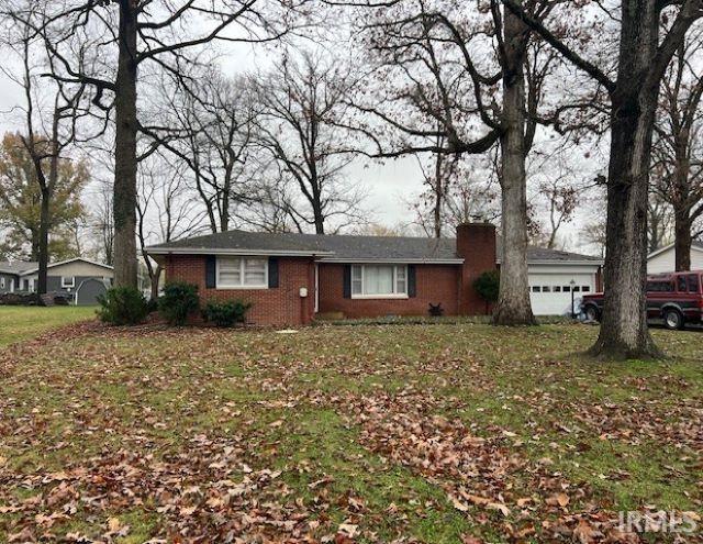 single story home featuring a garage