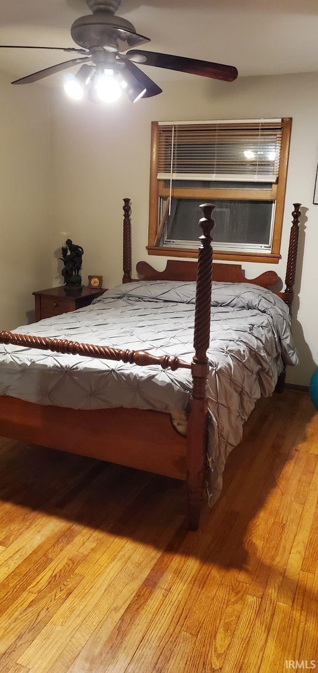 unfurnished bedroom featuring ceiling fan and hardwood / wood-style flooring